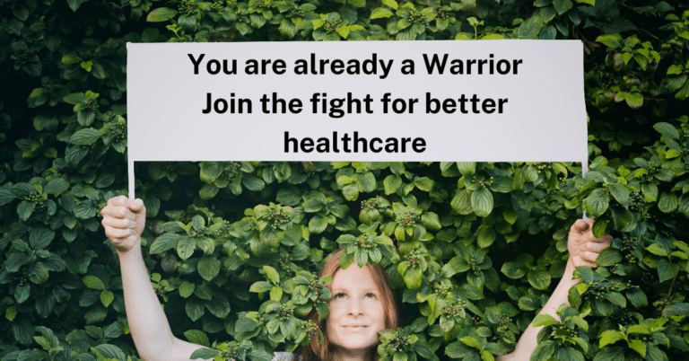 red haired woman deep in green leaves, holding a sign that says you are already a warrior join the fight for better healthcare illustrating the fertility activism article on best fertility now